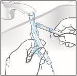 11. Remove the plunger from the barrel of the oral syringe and rinse both parts under tap water.