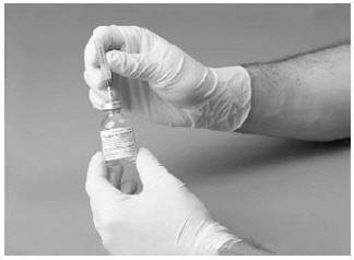 Remove the protective covering from the other end of the double-ended transfer needle.